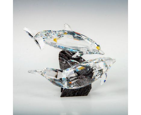 This retired Swarovski Soulmate Dolphin sculpture was part of the Soulmates theme group. The dolphins are made from fully fac