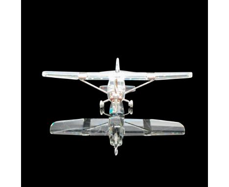 Figural was part of Sports and Trophies group. Clear faceted crystal is accented with rhodium propeller, wheels and wings. Sw