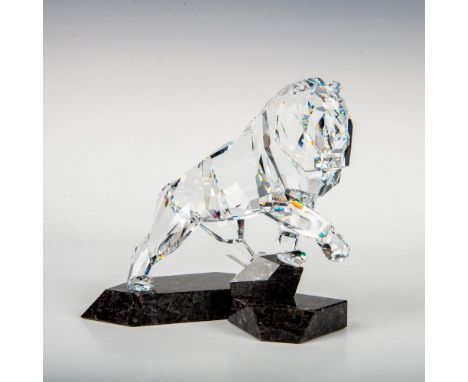 The lion is made of 24 clear crystal pieces with asymmetrical faceting to accentuate its power and charisma. He stands on a t