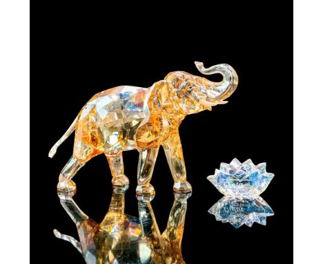 Swarovski Crystal Figurine, Cinta Elephant and Plaque 1137207. A clear amber colored crystal elephant with fogged crystal for