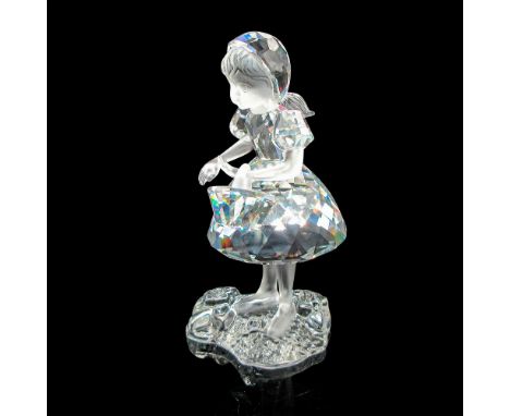 Adorable figurine with frosted arms and face. Crystal basket with frosted handle. Swarovski backstamp. This item has its orig