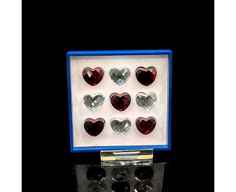 Unique game set in designed box with red and clear crystal heart pieces. Swarovski mark on top of box. This item has its orig