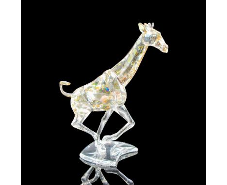 Illuminated by desert glow effect designed to create the illusion of giraffe's spots. Swarovski backstamp. This item has its 