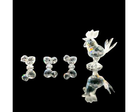 Rooster (1987) 14497 and a set of 3 Chicks (1988) 14824. This rooster has a clear crystal body and frosted comb with black cr