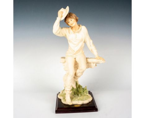 Figurine features a lovely cowgirl sitting on a fence set on a square wooden base. Figurine 1192F. Giuseppe Armani golden pla