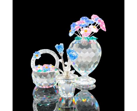 Includes 3 floral figures - crystal vase, basket and larger vase with floral arrangement. Florals are in blue and pink crysta