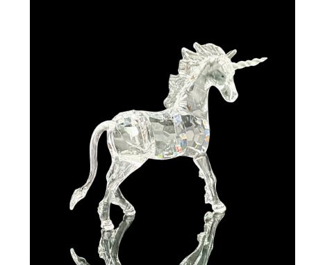 A clear crystal mythical creature with a frosted crystal horn. Swarovski marking on the base. This item has its original box: