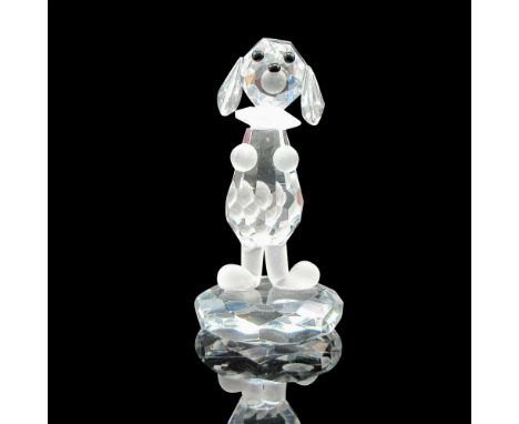 Clear faceted figural with frosted collar, paws and tail with black button eyes and nose standing on clear base. This item ha