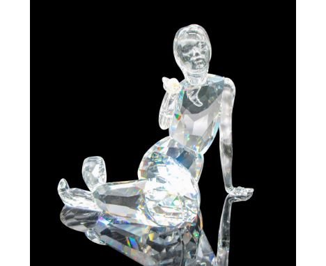 Lead crystal, depicting a sitting mermaid holding a pearl. Swarovski etched backstamp. This item has its original box: 7.75"L