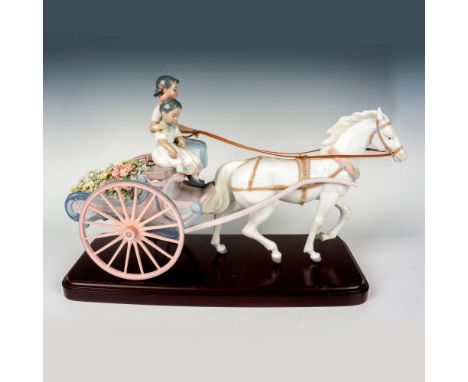 This detailed piece showcases young girls driving a horse-drawn cart of flowers, complete with the original reins. Lladro bac