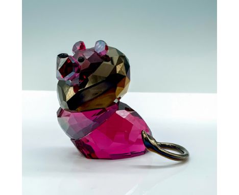 A magenta crystal lion with gold colored plating used for his mane and tail and black crystals for the eyes. Swarovski backst