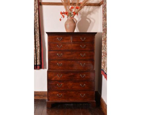 A George III mahogany chest on chest, circa 1780, the dentil moulded cornice, above two short and six long graduated drawers,