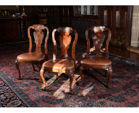 A set of three Chinese Export padouk chairs, circa 1735, after a design by Giles Grendey, each pierced and shaped back with a