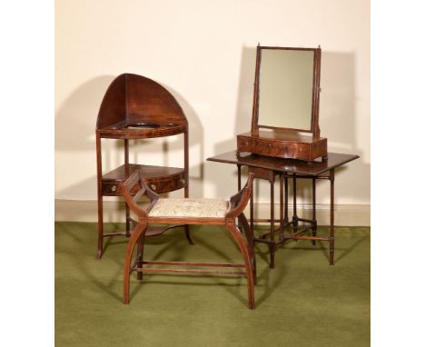 A George III mahogany dressing mirror, circa 1780, with boxwood stringing throughout, the rectangular swing plate above the s