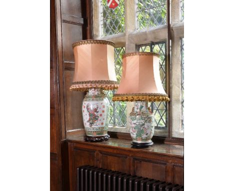 A large Chinese famille verte vase, 20th century, painted with a warrior panel to each side, and later fitted for electricity