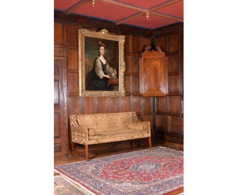 A George III chestnut sofa, circa 1790, with brass studded detail to upholstery throughout, the padded and upholstered rectan