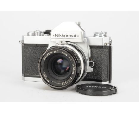 A Nikon Nikkormat FT2 SLR Camera, chrome,serial no 5033666, shutter working, timer working, body G, small dings to base plate