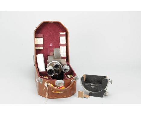 A Bell &amp; Howell Filmo 70-DR 16mm Camera, serial no. 17878, marked 'Latola Films', spring motor runs, body F, with a Taylo