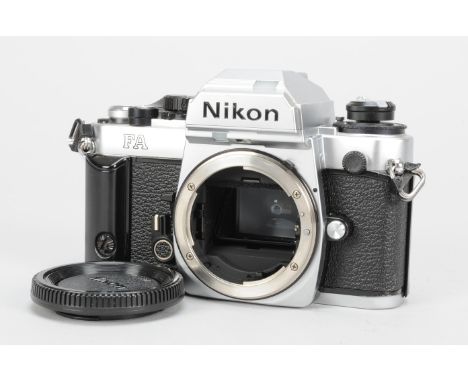 A Nikon FA Camera Body, chrome, serial no 5203949, shutter working, timer working, body VG, in case, with body case 