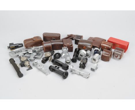 Leitz Camera Accessories, including a self-timer, chrome rangefinder, a chrome right angle viewfinder, five black right angle