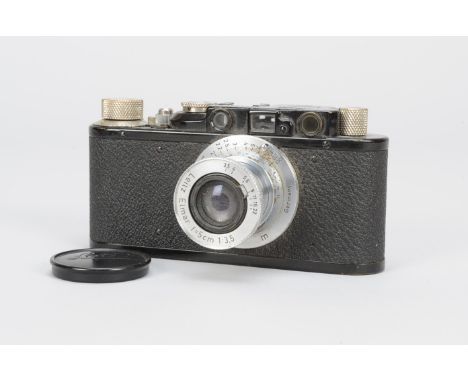 A Black Leica II Camera,  serial no. 93082, 1932, shutter  working, body P-F, scuffing to top plate and film wind knob, age-r