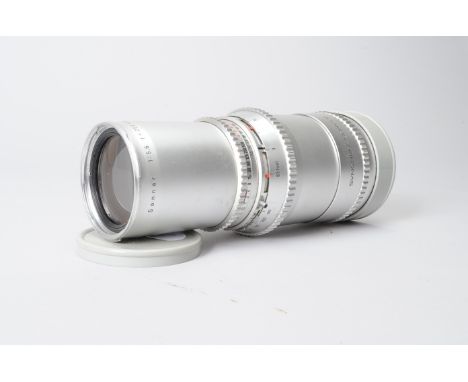 A Hasselbald Carl Zeiss 250mm f/5.6 Sonnar lens, serial no 4381115, barrel G, light scratches, elements F-G, fungus , with le