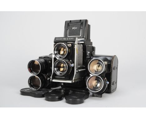 A Mamiya C330 Professional F TLR Camera and Lenses serial no D 132698, shutter working, body VG, scratching to mirror lock di