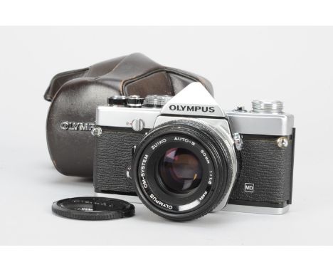 An Olympus OM-1 MD SLR Camera, chrome, serial no 305589, shutter working, timer working, body G- VG, with Zuiko 80mm f/1.8 Au