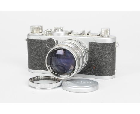 A Leica Ic Camera, serial no 560356, 1951, shutter working, crinkling in shutter blind, no viewfinder, body F-G, with a  Leit