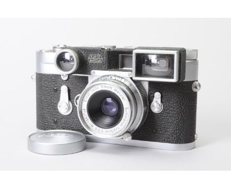 A Leica M3 Single Stroke Camera, chrome, serial no. 964523, 1959, self-timer and shutter working, first curtain opening sligh