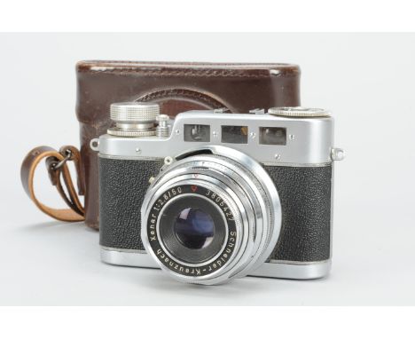 A Diax IIa Rangefinder Camera, with 50mm f/2.8 Xenar lens, serial no 3805427, shutter sluggish on slow speeds, body G, wear t