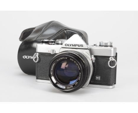 An Olympus OM-1 MD SLR Camera, chrome, serial no 1496317, shutter working, timer working, body G-VG, light marks to base plat