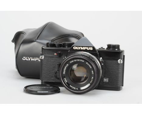 An Olympus OM-1 MD SLR Camera, black, serial no 1742163, shutter working, timer working, body VG, with Zuiko 50mm f/1.8 auto-