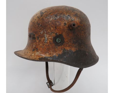 Imperial German Irish Issue Steel Helmetwhite painted helmet of typical form with large side vent studs.  The front with smal