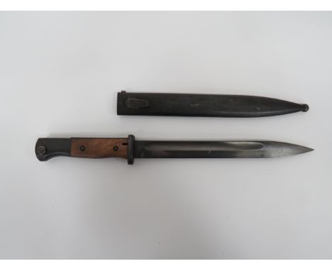 WW2 German K98 Mauser Bayonet10 inch, single edged, blued blade with large fuller.  Forte stamped ‘44 FNJ”.  Blued steel cros
