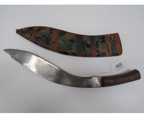 WW2 Dated Indian Made Kukri13 1/2 inch, single edged blade of typical form. Blade stamped “Siraj. 44”. Simple plain wooden sl