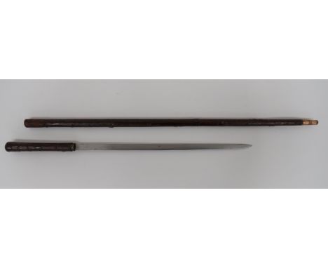 Victorian Sword Stick18 1/4 inch, single edged blade. Brass ferrule. Brown lacquer, wood effect handle. Contained in its matc