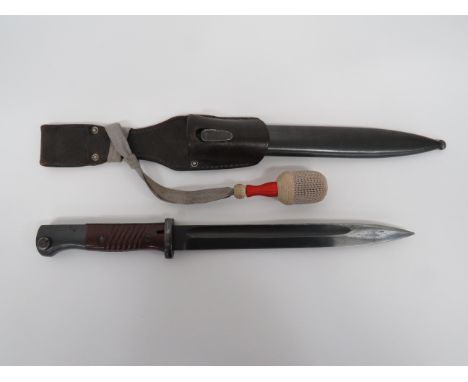 Mauser K98 Bayonet with Frog and Knot9 3/4 inch, blued, single edged blade with narrow fuller.  The forte stamped “W.K.C.”.  