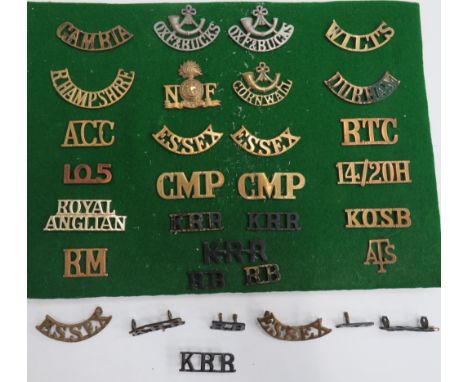 Selection of Brass Shoulder Titlesincluding Gambia ... Wilts ... R Hampshire ... Durham ... Essex ... RTC ... CMP ... KOSB ..