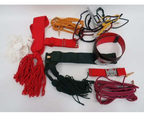 Selection of Various Unissued Belts and Sashesitems include black leather Scottish belt with chrome plated, rectangular buckl