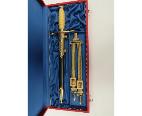East German Officer’s Dagger10 inch, polished, double edge blade.  Narrow double fullers.  Brass S shape crossguard terminati