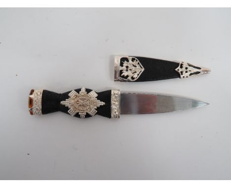 Current Issue Black Watch Skean Dhu3 3/4 inch, single edged blade with clipped back edge.  Silvered thistle decorated ferrule