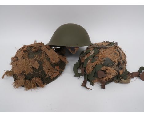 Selection of Post WW2 British Steel Helmetsconsisting green painted Armoured Troops, pudding basin helmet.  Rubber and nettin