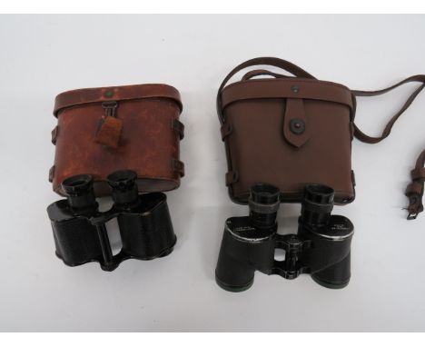 Two Pairs of British Pattern Binocularsconsisting pair of “W Watson &amp; Sons Ltd London” issue binoculars.  Large broad arr