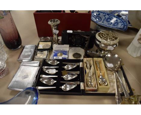 A selection of flatware and plated ware, cigarette cases,commemorative and similar coins also included is a vintage Trichro s