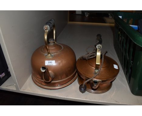 Two vintage copper kettles.