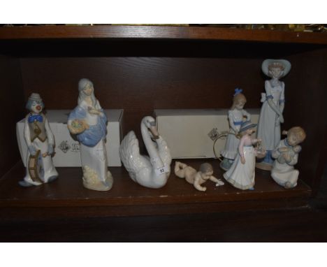 A collection of eight Lladro, Nao an similar figurines and studies including Nao Girl with Dog and Hoop, boxed, Girl wearing 