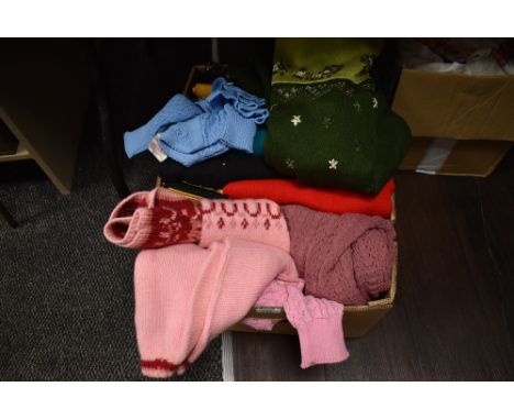 A selection of ladies retro and vintage knitted jumpers and similar, some still with tags.