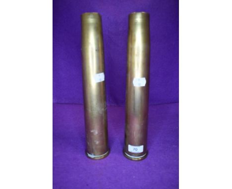 A pair of 40mm military ammunition shells dated 1942