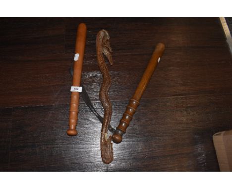 Two vintage police or similar style truncheons and an Indonesian style carved ceremonial club